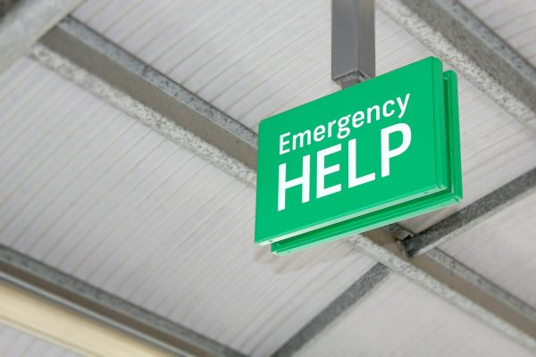 Emergency help sign at a public train station